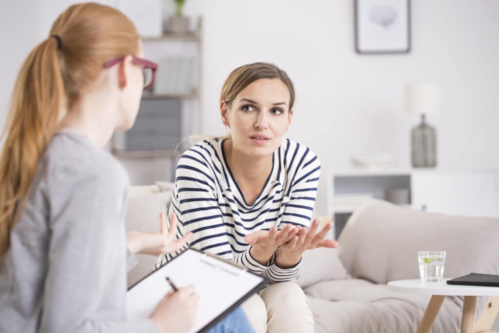 Woman clinician talking with female client