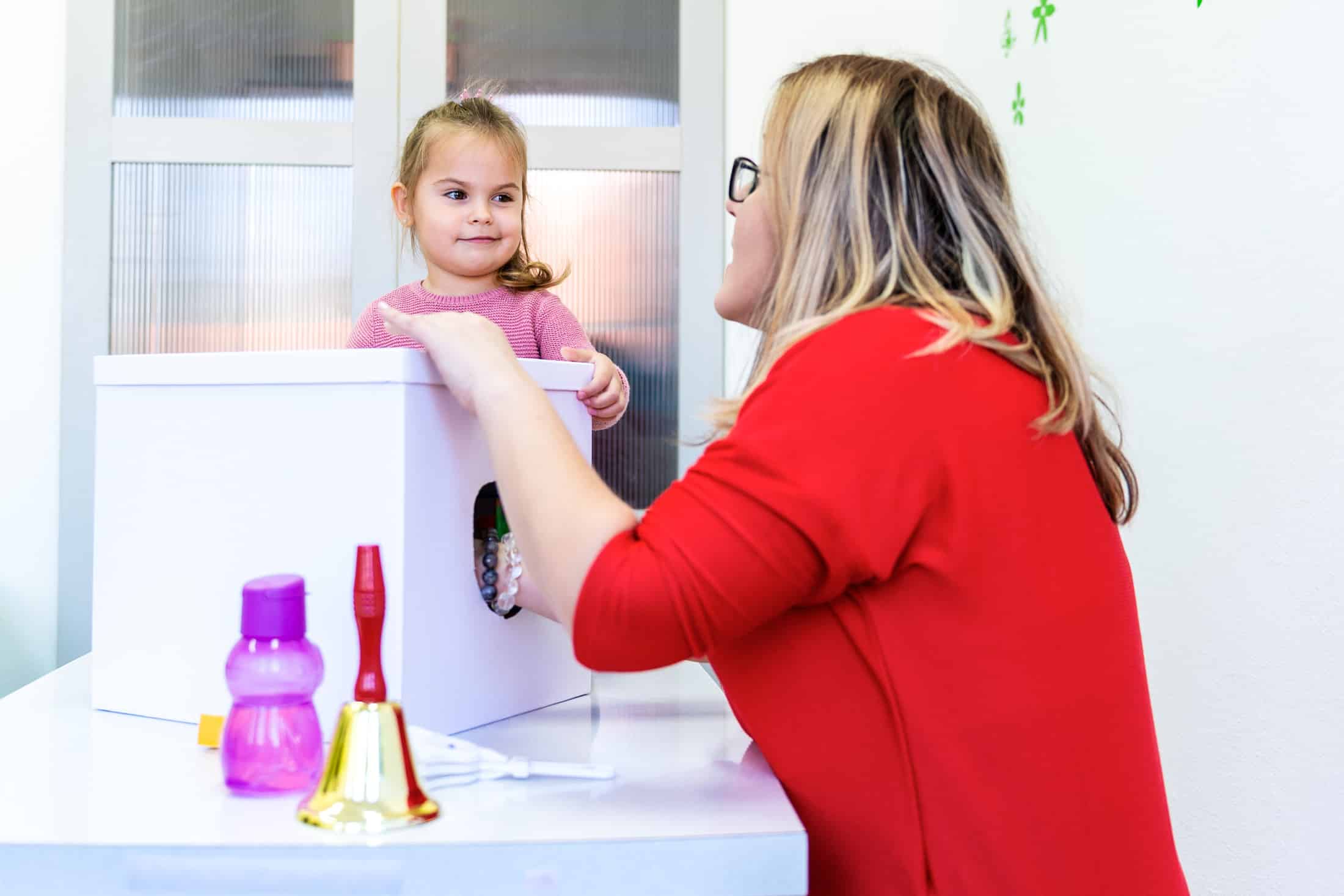 Child in therapy session with Clinican
