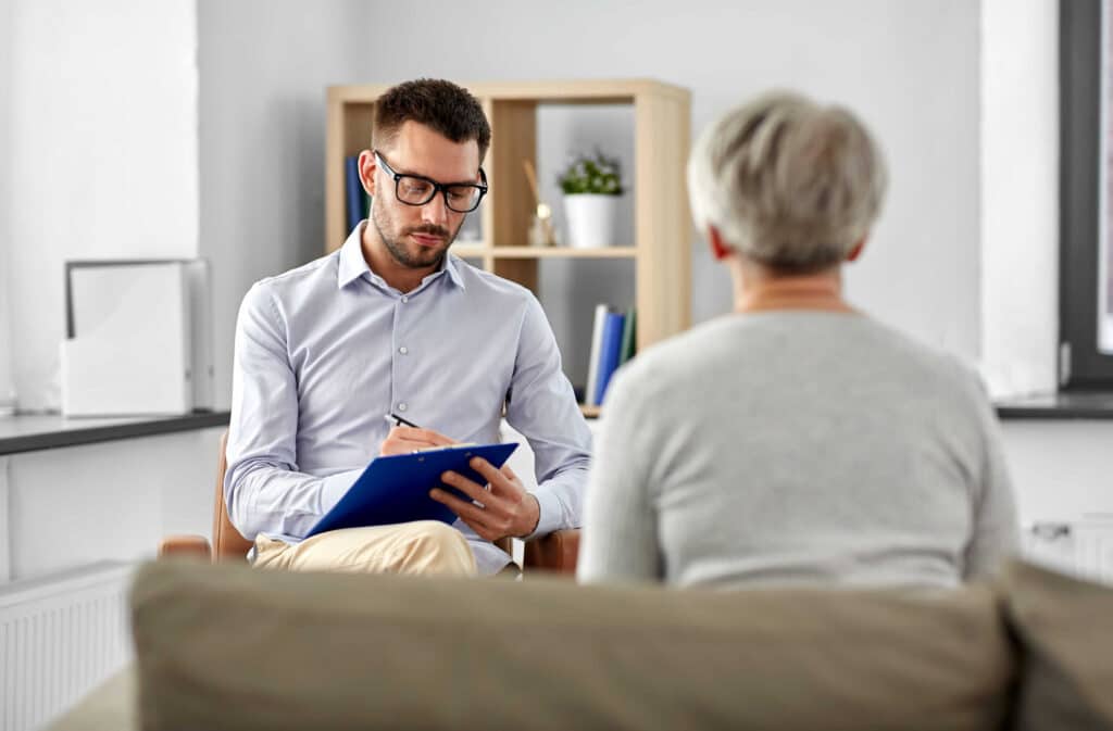Clinician in meeting with adult client