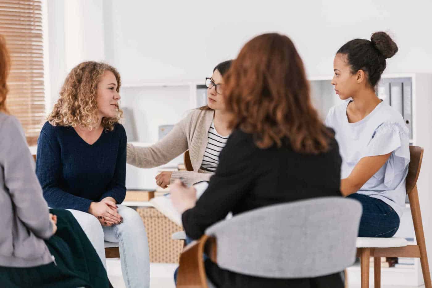Women in group therapy meeting