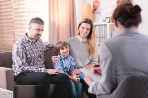 Parents with child and therapist