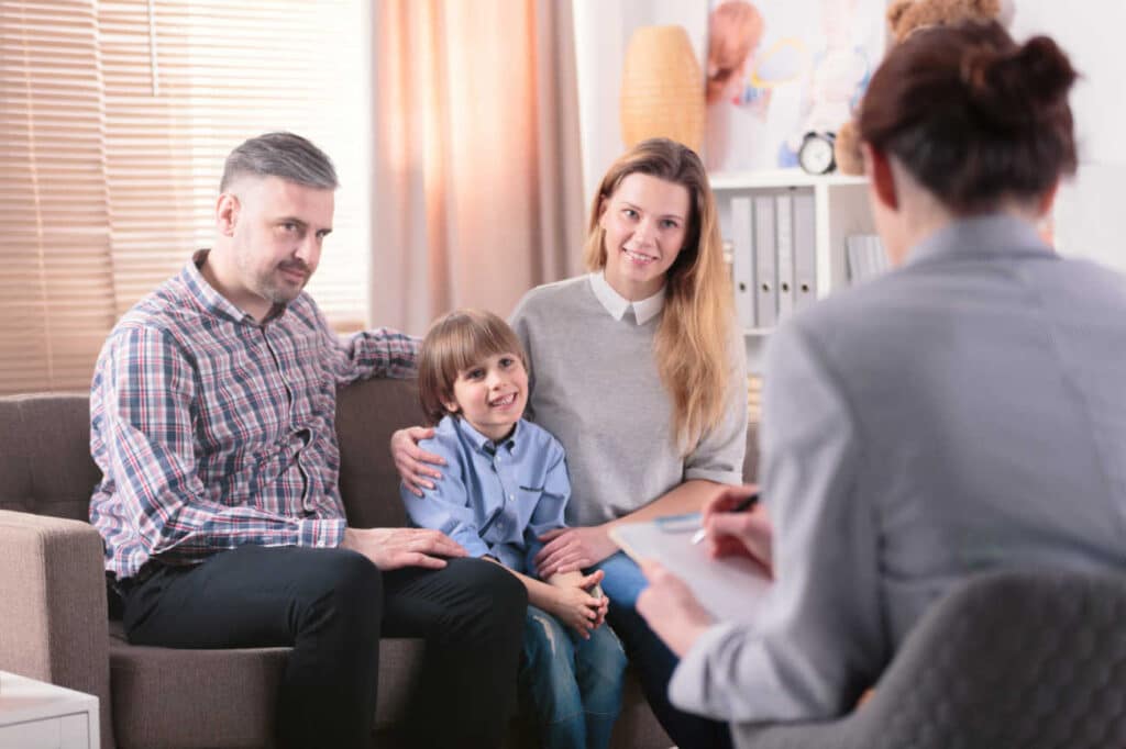 Parents with child and therapist