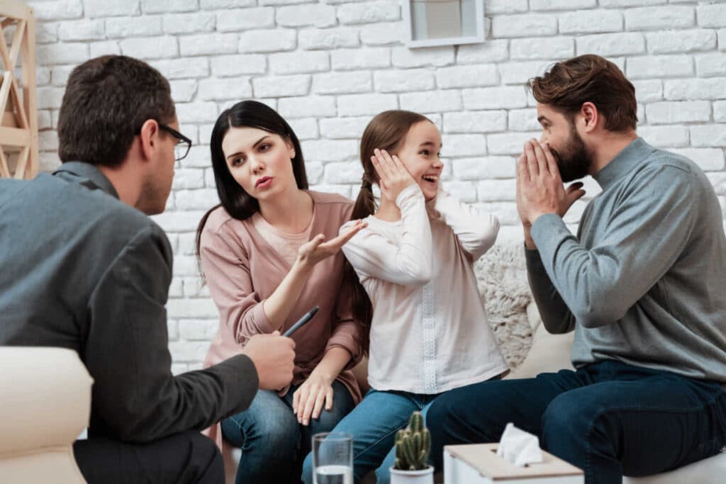 Parents with their child in a therapy session