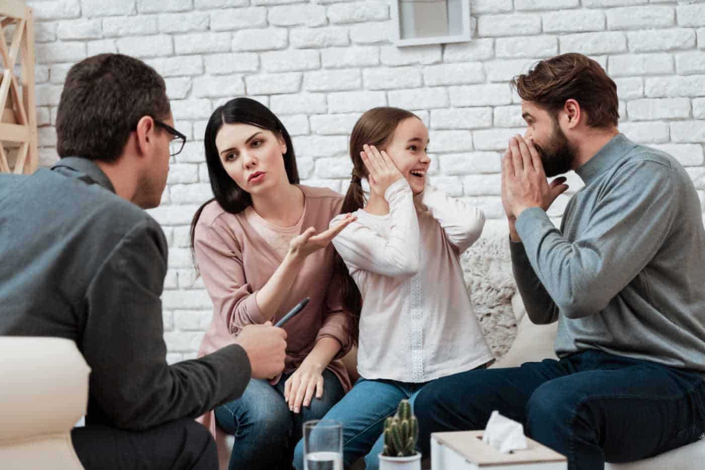 Parents with their child in a therapy session