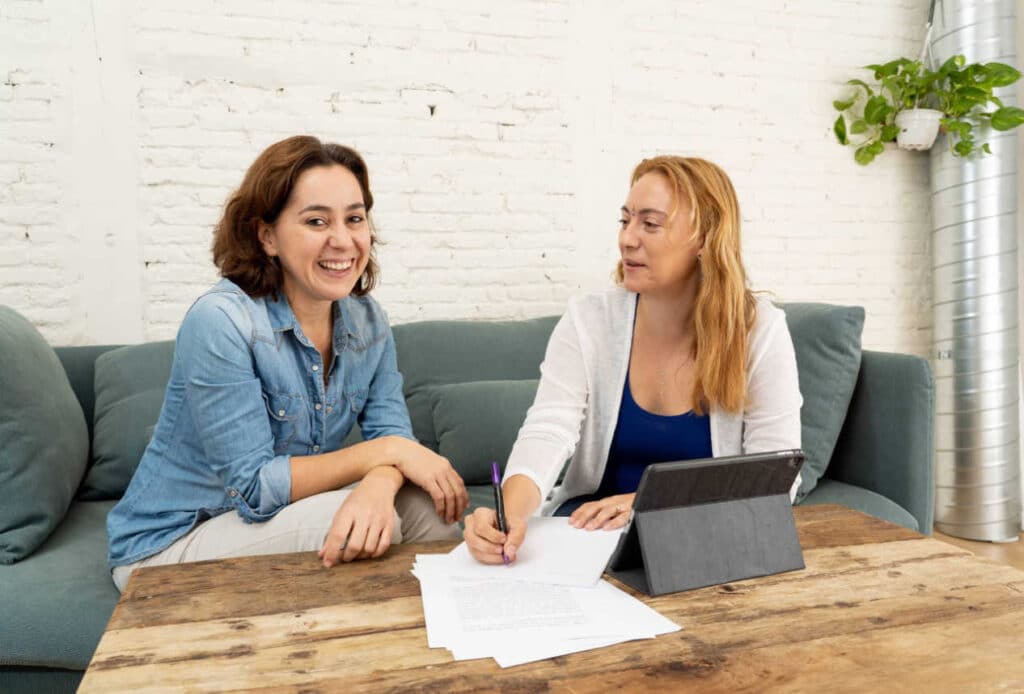 Two women on sofa talking
