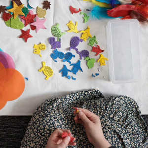 top down view of child working with shapes as part of a play therapy session