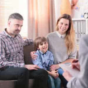 Child ren and parents meeting with a therapist