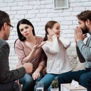Child with parents in therapy session