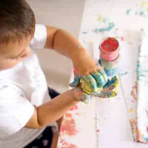Child modelling with clat in play therapy session