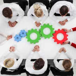 Helicopter view of team of employees at an office table