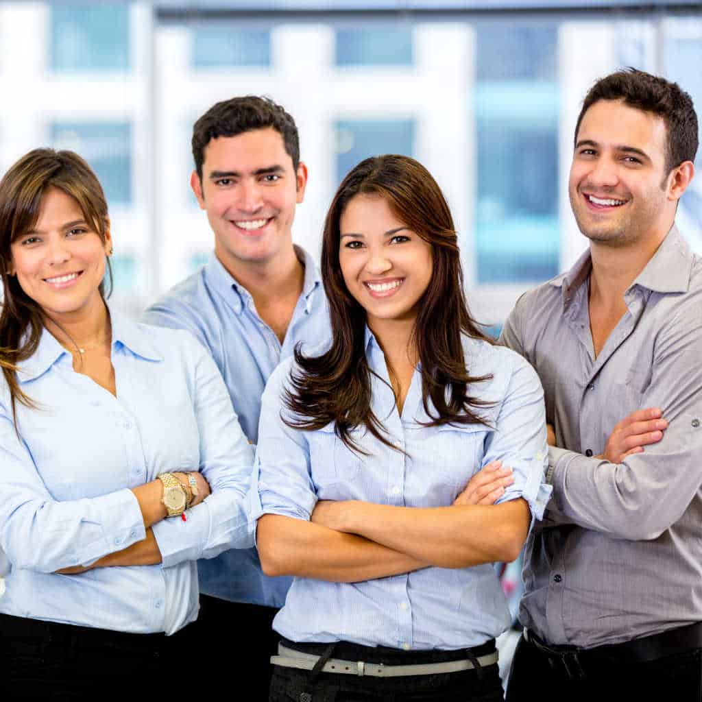 group of four office smiling workers