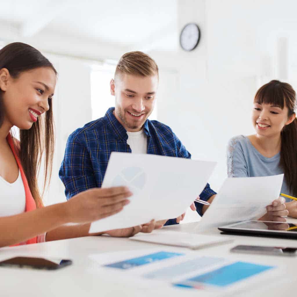 Office workers engaged in active discussion