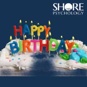 Birthday Cake with candles to celebrate Shore Psychology's first birthday