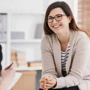 Female counsellor smiling at client