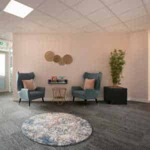 Internal waiting room with circular rug at Shore Psychology